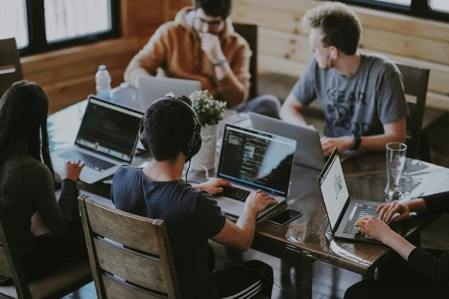 Team collaborating around a table in a loft office